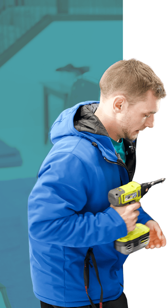 Professional mover using a cordless drill for packing or assembly.