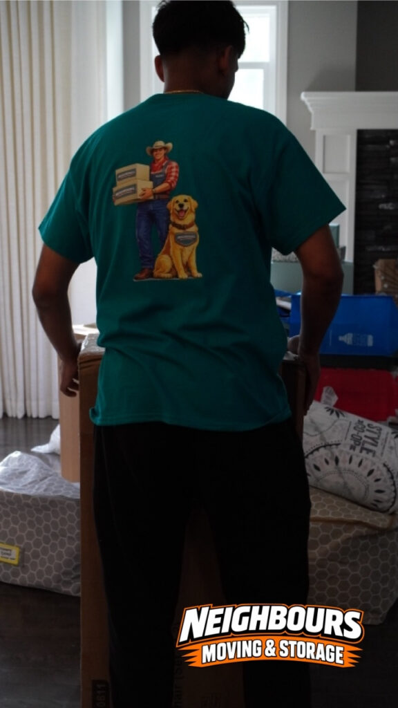 Neighbours Moving & Storage team member carrying packed household items during a residential move